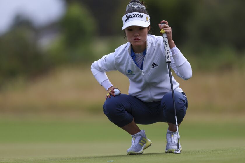 Australia's Grace Kim prepares to putt on the 12th hole during the Australian Open golf championship at Kingston Heath golf course in Melbourne, Australia, Thursday, Dec. 1, 2022. (AP Photo/Asanka Brendon Ratnayake)