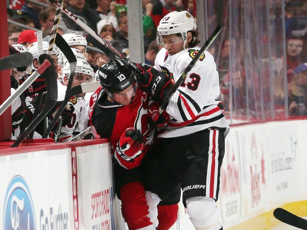 Blackhawks left wing Daniel Carcillo, seen here hitting Devils defenseman Peter Harrold earlier this season, got off light with only a six-game suspension after injuring Winnipeg's Mathieu Perreault.