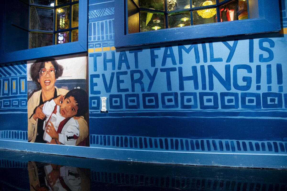 A photo of two family members next to the words, "THAT FAMILY IS EVERYTHING!!!"