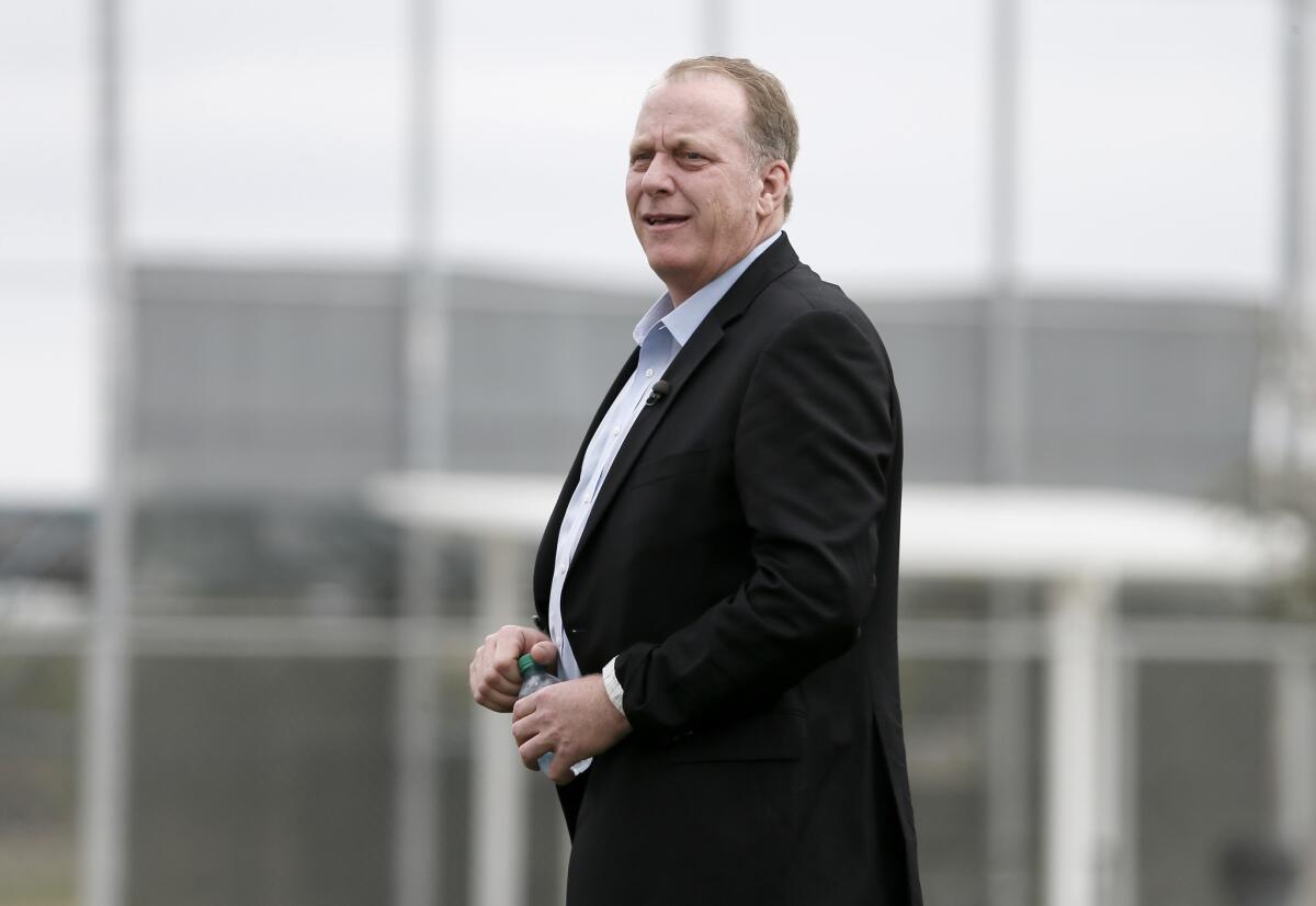 ESPN analyst and former MLB pitcher Curt Schilling watches as the Boston Red Sox work out at baseball spring training in February.