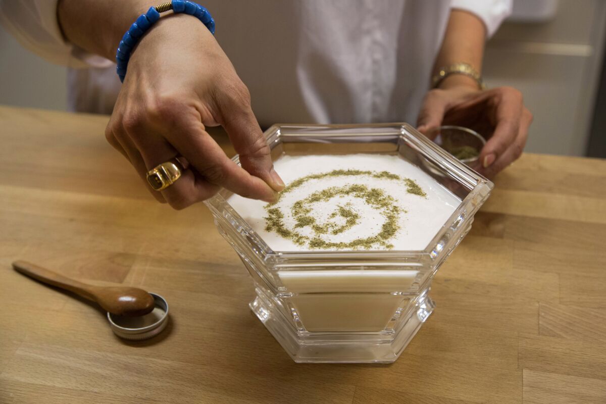 Shamsi Katebi makes her own yogurt a Persian spice blend on top. She also makes her own pickled garlic and vegetables, also known as torshi.