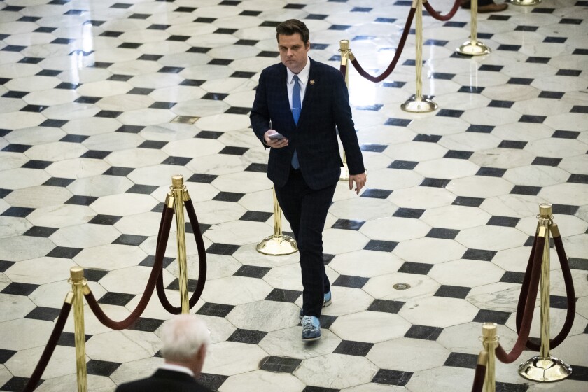 FILE - In this Dec. 18, 2019, file photo Rep. Matt Gaetz, R-Fla., walks off the House floor as House of Representatives takes up articles of impeachment against President Donald Trump on Capitol Hill in Washington. (AP Photo/Matt Rourke, File)