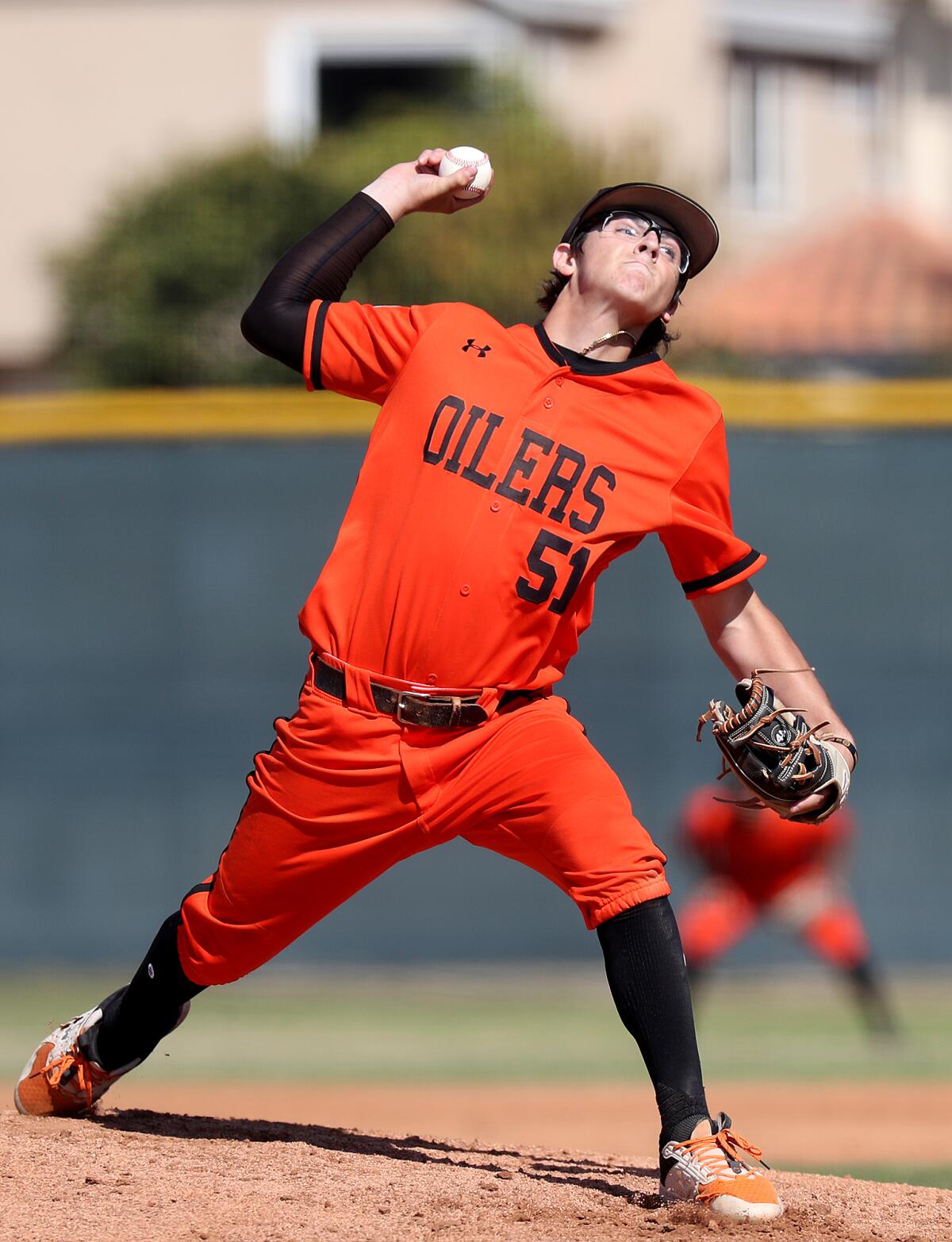 Huntington Beach starter Matthew Lopez pitches against Edison during the first inning of Friday's Surf League game.