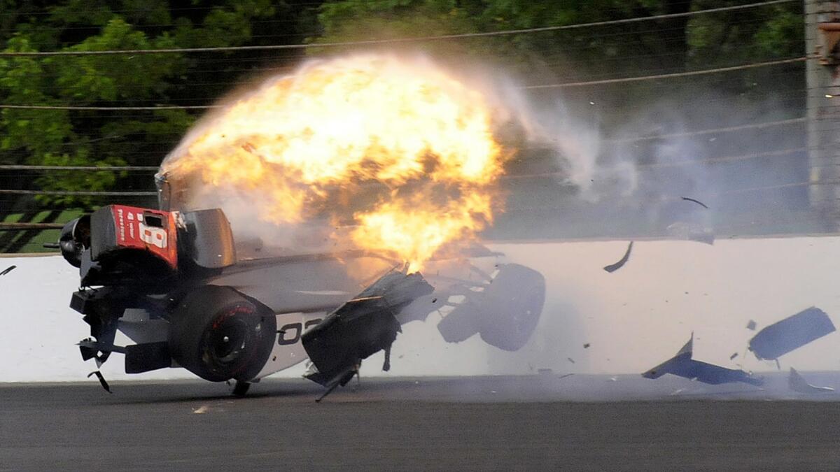 The car of driver Sebastien Bourdai bursts into flames after it hit the wall in Turn 2 during qualifying for the Indianapolis 500 on Saturday.