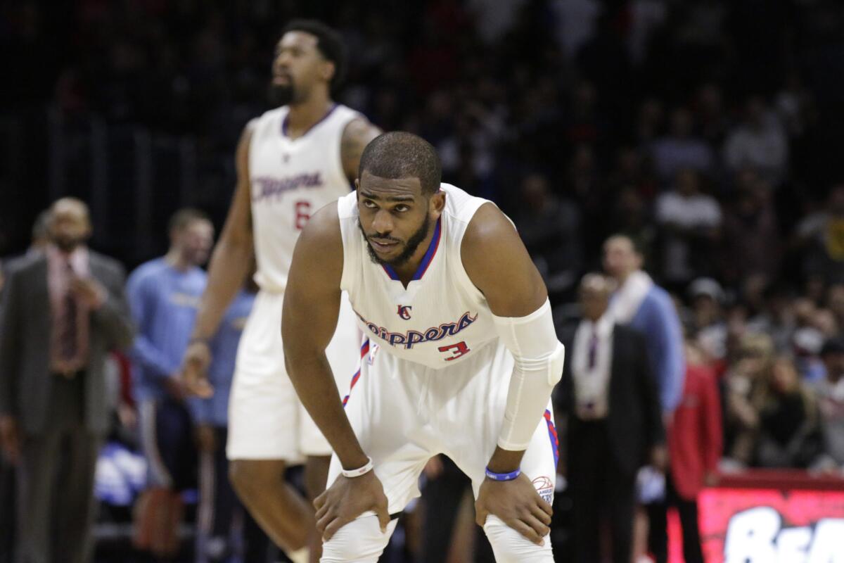 A dejected Clippers point guard Chris Paul looks up after having the ball stolen by Mike Conley in the final seconds of the Grizzlies' 90-87 win at Staples Center.
