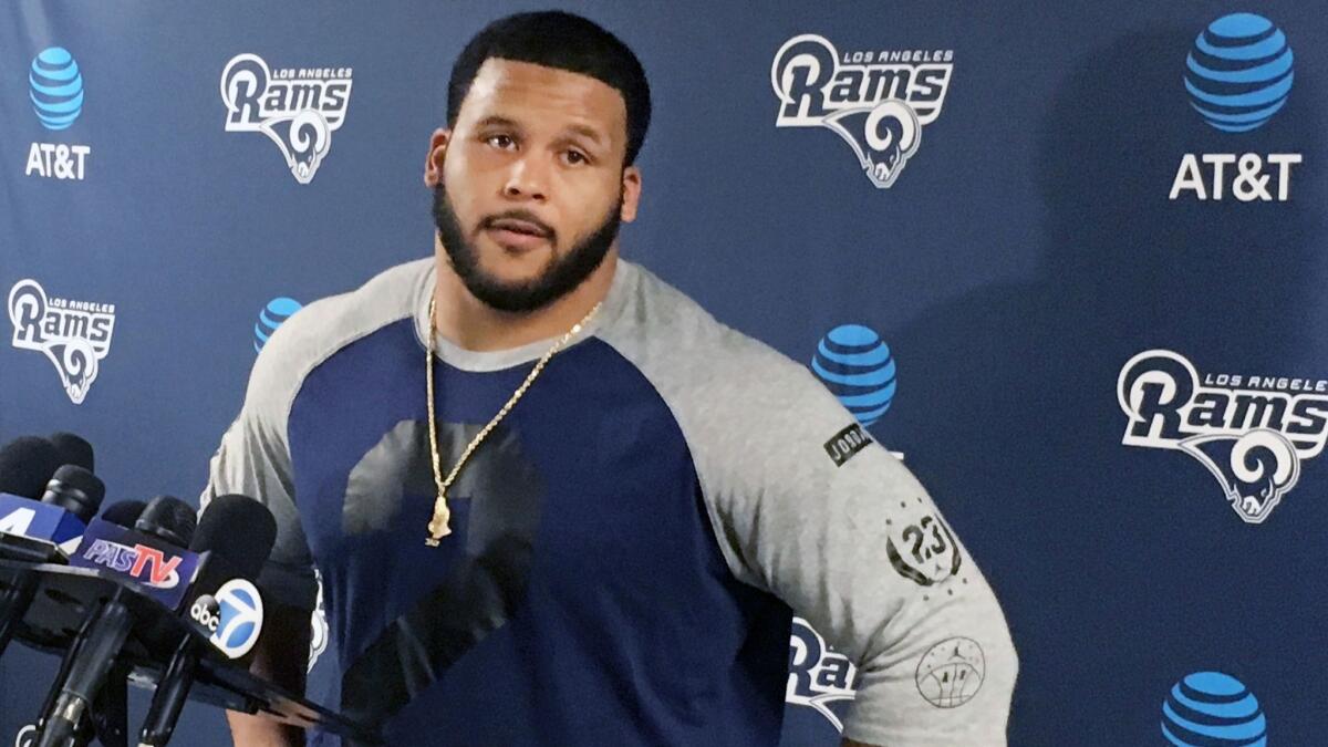 Aaron Donald addresses the media in April.
