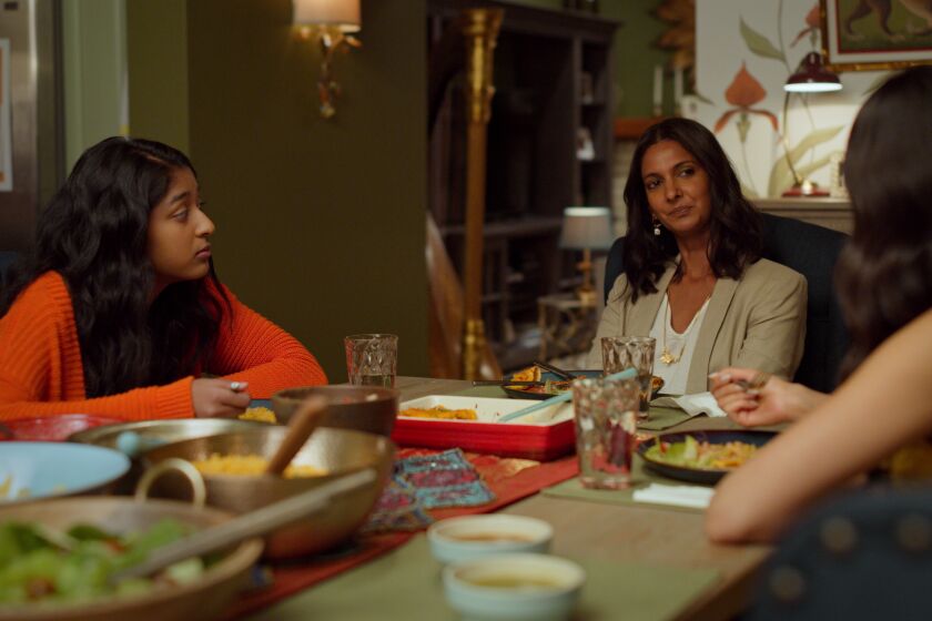 Maitreyi Ramakrishnan, left, Poorna Jagannathan, and Richa Moorjani in a scene from "Never Have I Ever."