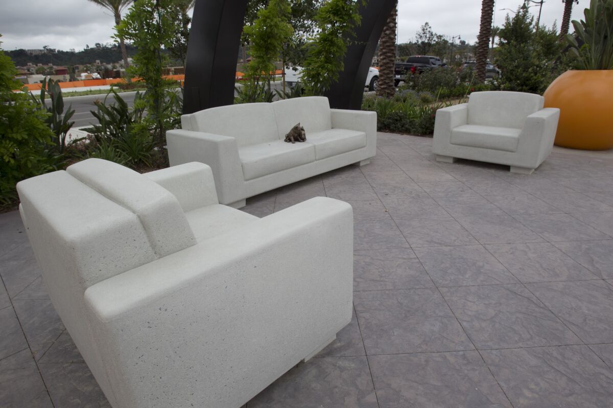 Concrete sofa and chairs are one of the unique features of the park. A bronze rabbit sits in the middle of the couch to discourage homeless from sleeping on the furniture.