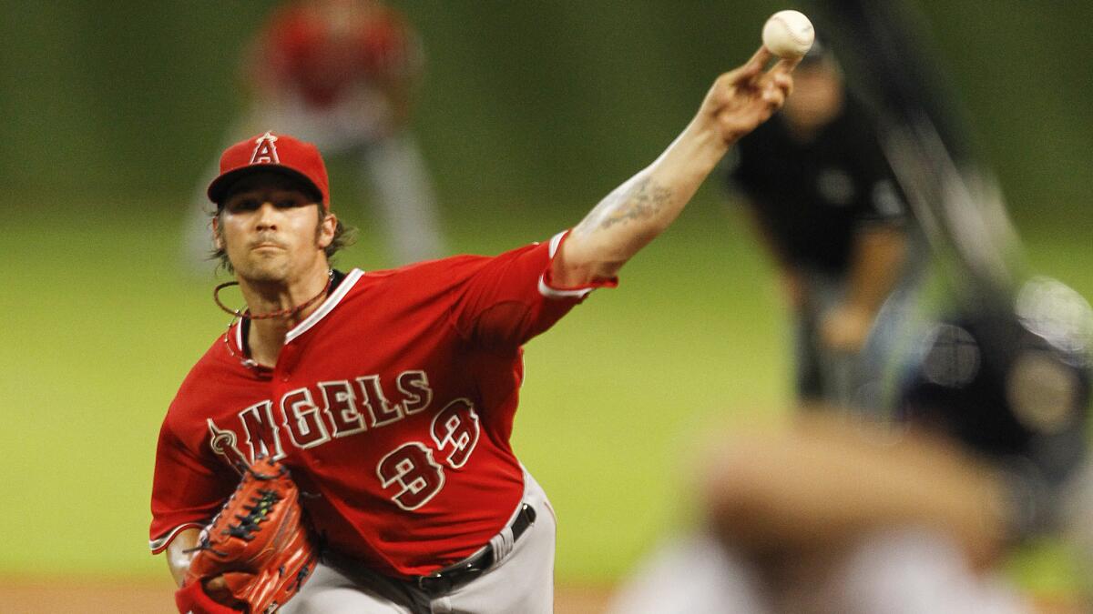 Angels starter C.J. Wilson delivers a pitch in the team's 8-3 loss to the Houston Astros on Tuesday.