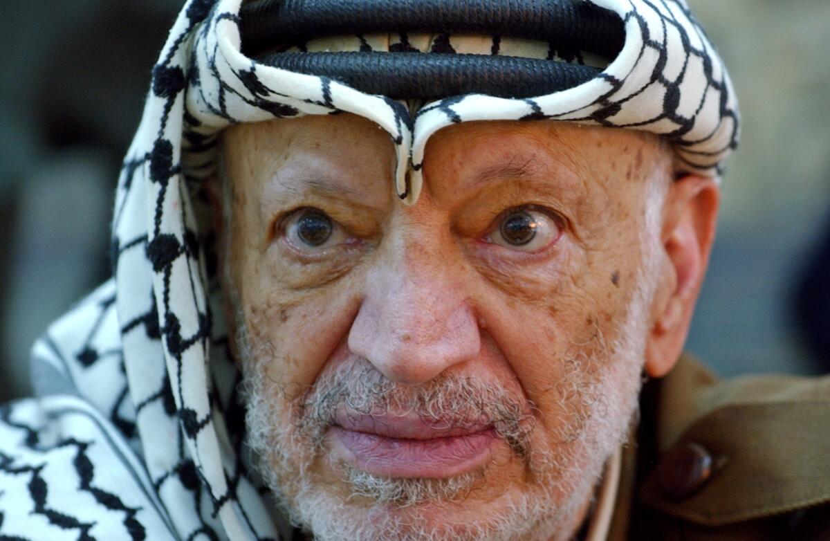 Russian forensic scientists said Thursday that Palestinian leader Yasser Arafat, shown here a month before he died, was not poisoned with polonium. The Russians' conclusion conflicts with that of a Swiss team, which reported in November finding high levels of polonium in Arafat's remains and deciding with relative certainty that he had been poisoned with the radioactive substance.