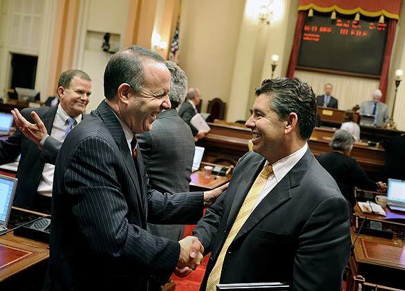 Sen. Abel Maldonado of Santa Maria, right, exchanges congratulations with Senate President Pro Tem Darrell Steinberg of Sacramento. Maldonado provided the final Republican vote needed to pass the long-stalled California spending plan, which includes more than $12 billion in tax hikes.