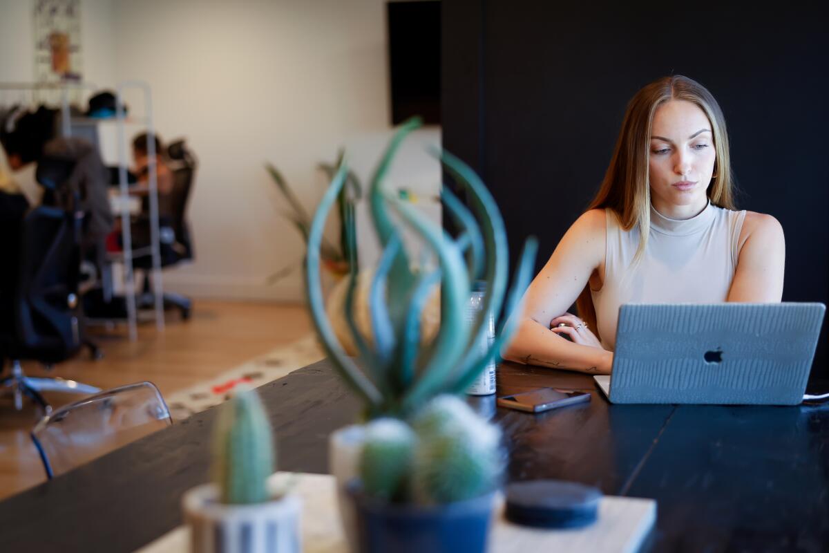 A woman at a computer.