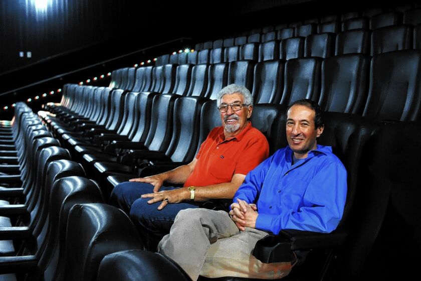 Robert Laemmle and his son Greg sit at the Laemmle Royal Theatre in West Los Angeles. “If you look at the track record of family businesses that have made it, to have survived this many generations is quite a remarkable achievement,” Greg Laemmle said.