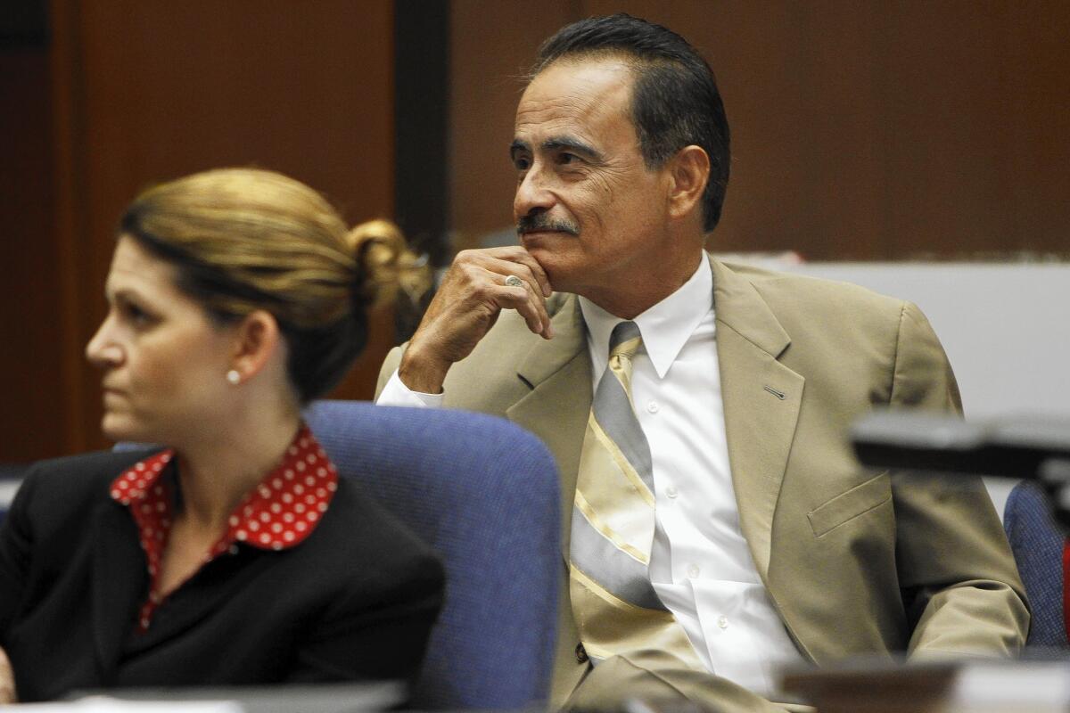 Former Los Angeles City Councilman Richard Alarcon with attorney Courtney Overland during opening statements in his perjury and fraud trial.