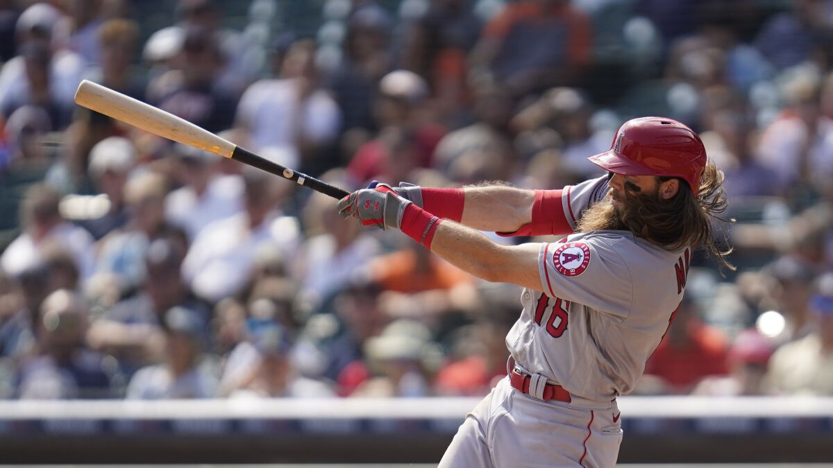 Brandon Marsh of the Angels hits a two-run triple against the Detroit Tigers.