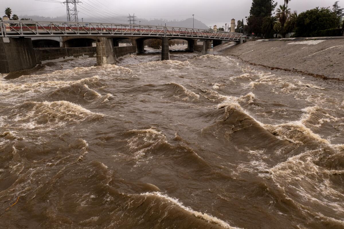 The Los Angeles River is a raging torrent as powerful storms hit California. 