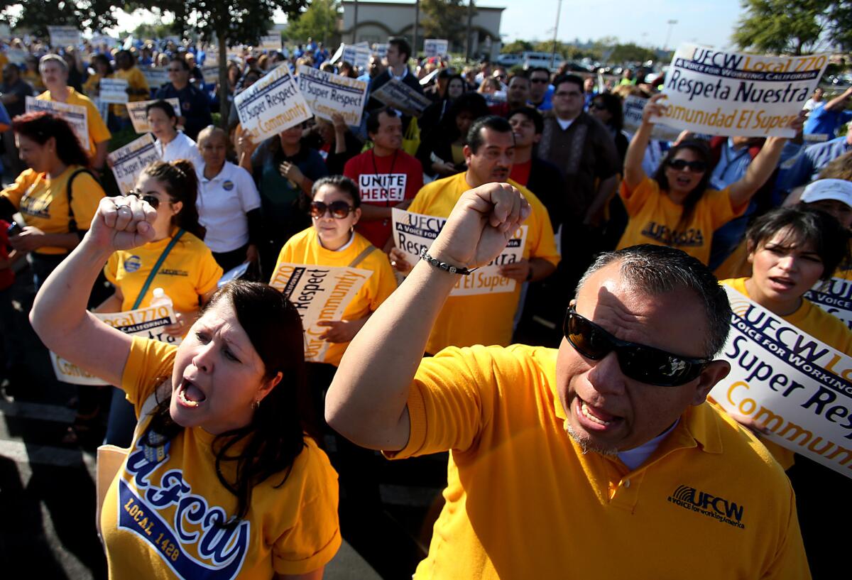 Members of the United Food and Commercial Workers union march in support of El Super grocery workers in Inglewood in October 2013. The UFCW said El Super workers in the Southland have been without a union contract since September 2013.