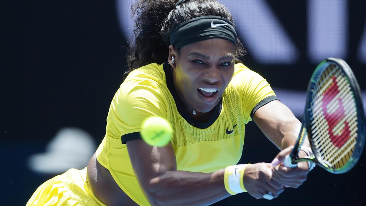 Serena Williams returns a shot against Camila Giorgi in a first-round match at the Australian Open on Monday.