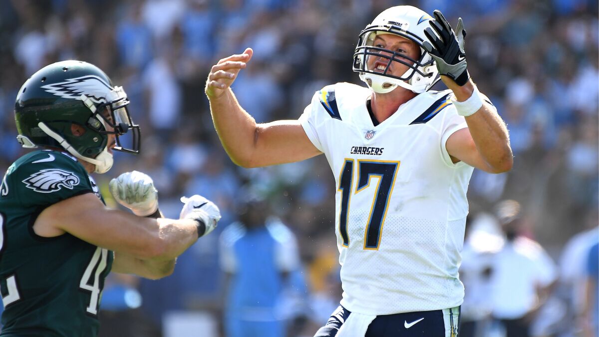 Philip Rivers looks for a pass-interference call as Eagles safety Chris Maragos celebrates the incomplete pass during the second quarter of the Chargers' 26-24 loss to Philadelphia at StubHub Center.