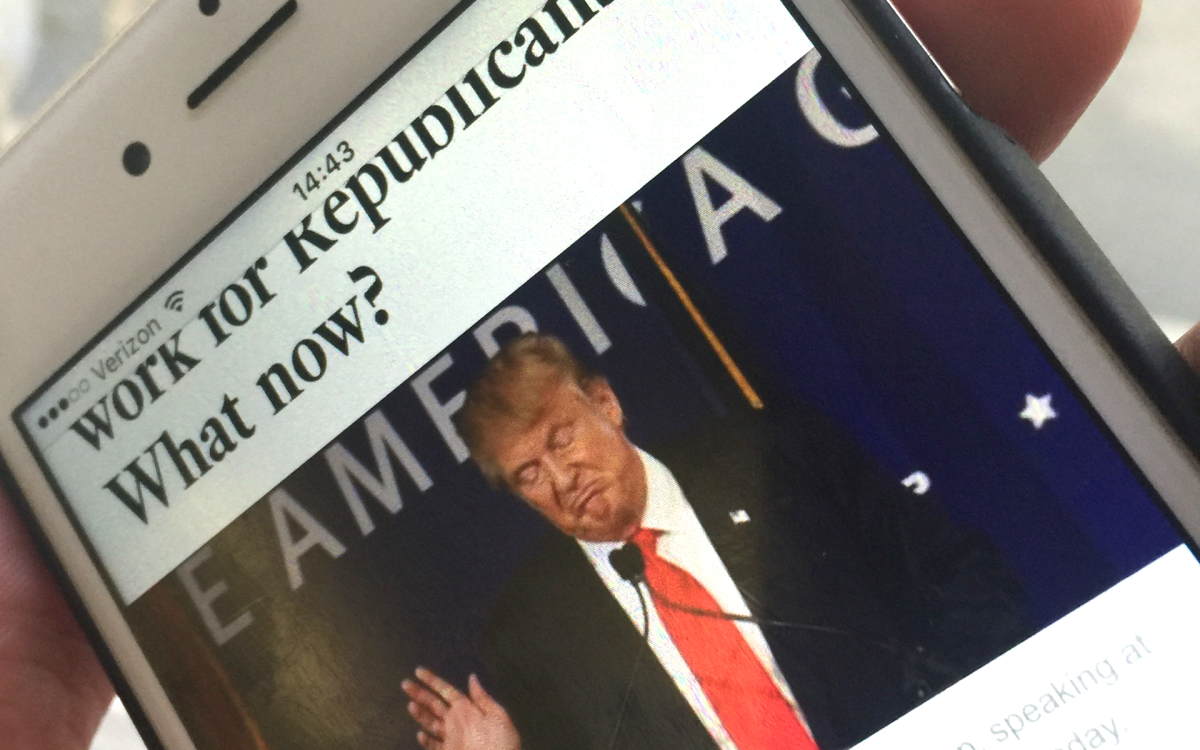 An iPhone displaying a Los Angeles Times article about Donald Trump