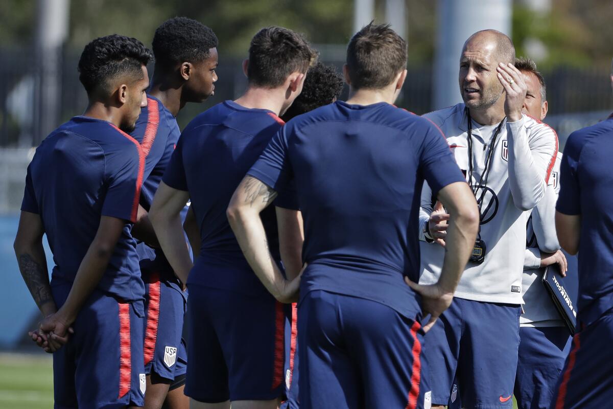 U.S. national coach Gregg Berhalter instructs players during drills at the team's Florida training camp.