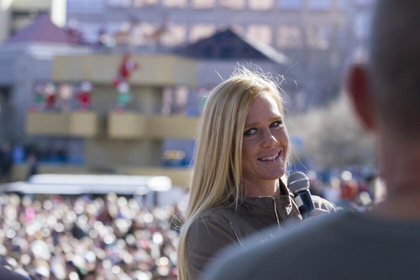 Holly Holm addresses a crowd of fans after a parade for the UFC women’s bantamweight champion in her native Albuquerque, N.M. in December.