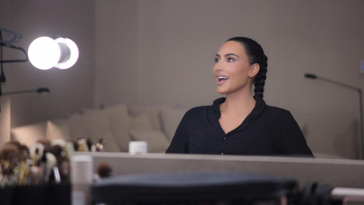 Kim Kardashian smiles