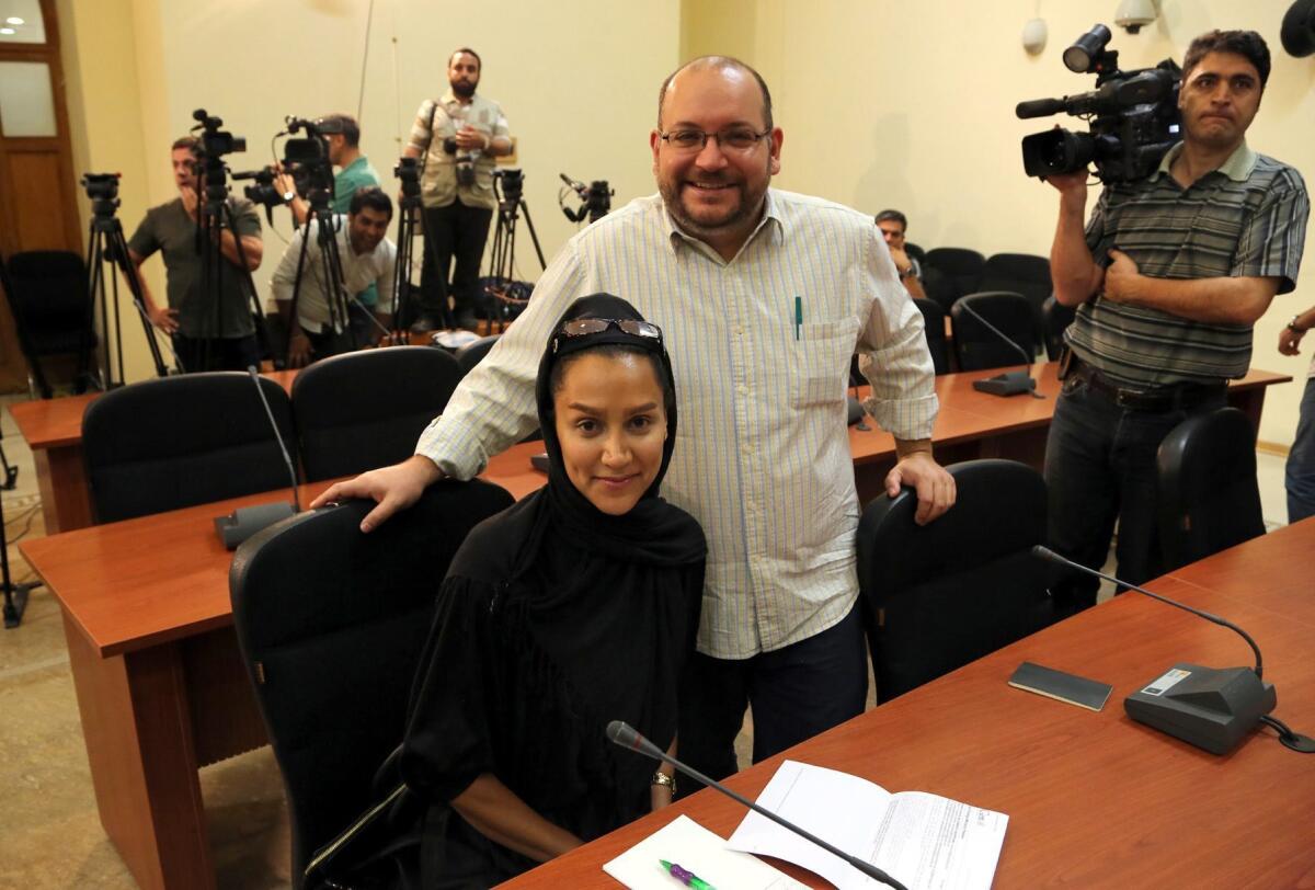 This September 10, 2013 photo shows the Washington Post Iranian-American journalist Jason Rezaian and his Iranian wife Yeganeh Salehi during a press conference in Tehran.