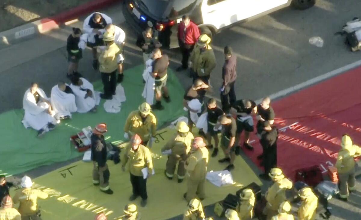 Firefighters and first responders at a crash scene