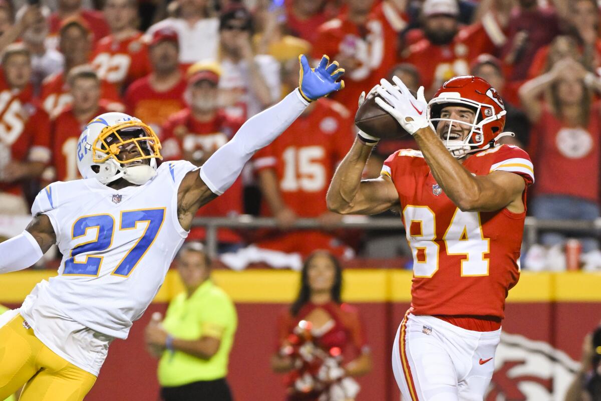 Kansas City Chiefs wide receiver Justin Watson pulls in a touchdown pass over Chargers cornerback J.C. Jackson.