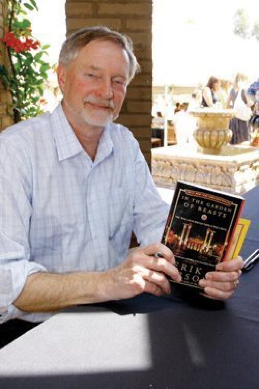 Author Erik Larson with his book “In the Garden of Beasts.”