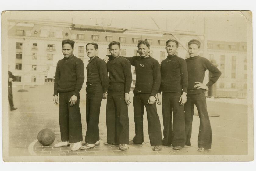 In this 1926 photo provided by the Rita M. Cacas Filipino American Community Archives, University of Maryland, are Filipino sailors in athletic uniforms at US Naval Academy in Annapolis, Maryland. Asian Americans, veterans and civilians in the U.S. and the Philippines are campaigning to name a Navy warship for a Filipino sailor who bravely rescued two crew members when their ship caught fire more than century ago, earning him a prestigious and rare Medal of Honor. (Rita M. Cacas Filipino American Community Archives, University of Maryland via AP)