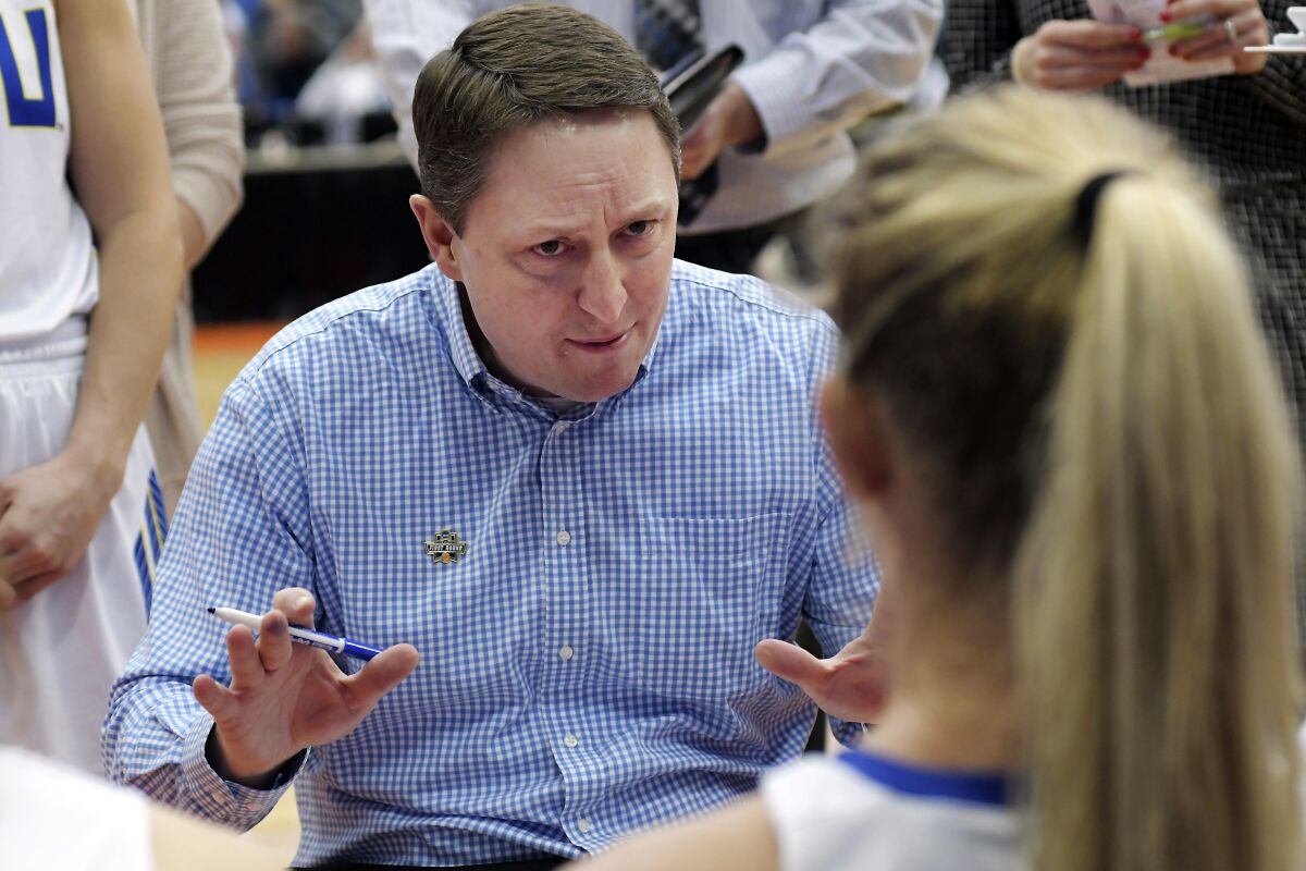 FILE - In this March 23, 2019, file photo, South Dakota State head coach Aaron Johnston speaks with is team during a timeout in a first-round game against Quinnipiac in the NCAA women's college basketball tournament in Syracuse, N.Y. South Dakota State entered The Associated Press Top 25 on Monday, Dec. 7, 2020, coming in at No. 22. (AP Photo/Heather Ainsworth, File)