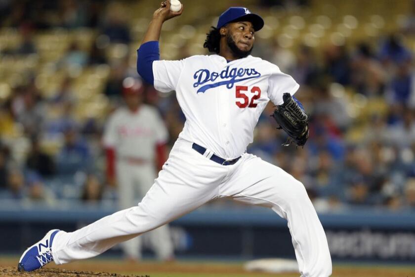 LOS ANGELES, CALIF. -- TUESDAY, MAY 29, 2018: Los Angeles Dodgers relief pitcher Pedro Baez (52) delivers a pitch against the Philadelphia Phillies in the top of the sixth inning at Dodger Stadium in Los Angeles, Calif., on May 29, 2018. (Gary Coronado / Los Angeles Times)