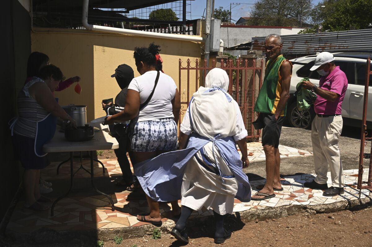 Nuns supervise a food line in Costa Rica.