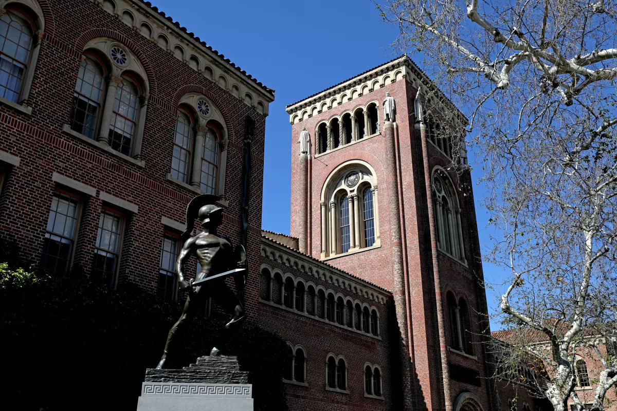 Bovard Administration Building with Tommy Trojan sculpture on the Campus of the University of Southern California.