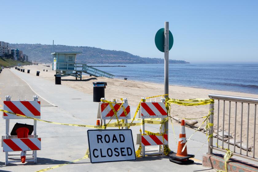 REDONDO BEACH, CA - APRIL 25: The beach near Veterans Park is closed on Saturday, April 25, 2020 in Redondo Beach, CA. South Bay beaches remain closed due to the COVID-19 pandemic with strict enforcement, despite this weekend's heatwave. (Gabriella Angotti-Jones / Los Angeles Times)