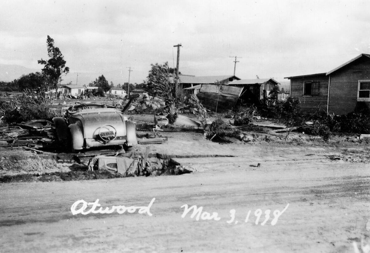 A black-and-white image of a sinkhole and debris in Atwood.
