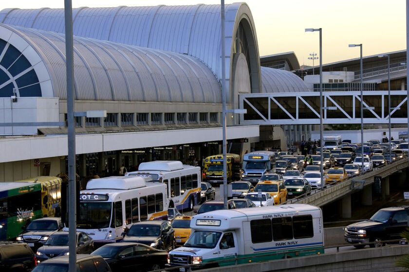 Cars, buses and vans make their way around LAX. Amid news of the first Ebola death in the United States, in Texas, Southland officials say they are working to get medical providers ready should an Ebola case emerge locally.
