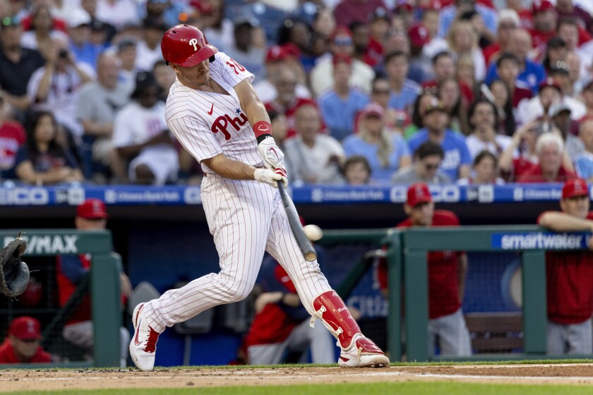 The Phillies' J.T. Realmuto hits a two-run double during the first inning June 4, 2022, in Philadelphia.