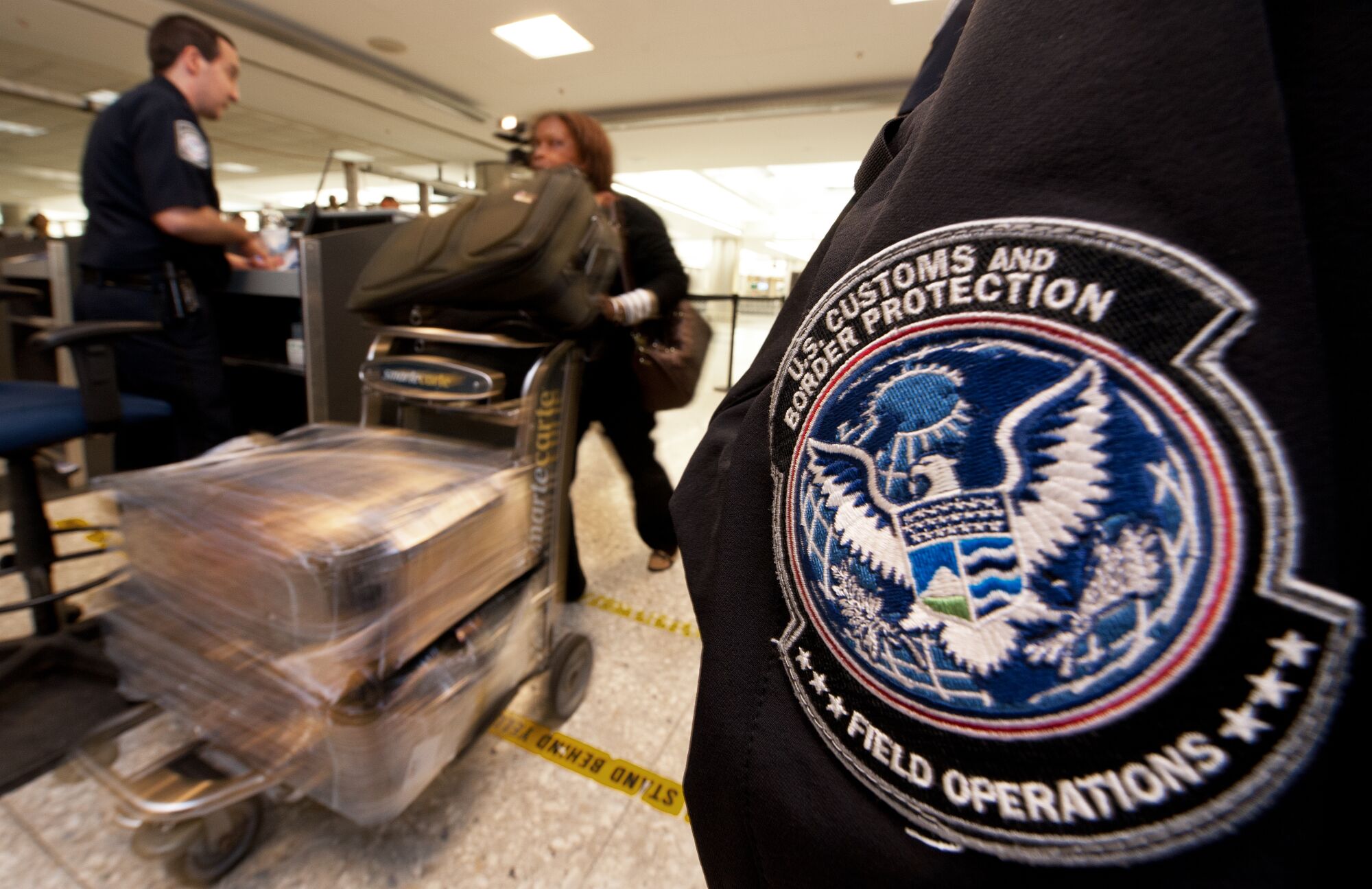 An international air traveler is cleared by a U.S. Customs and Border Protection Officer 