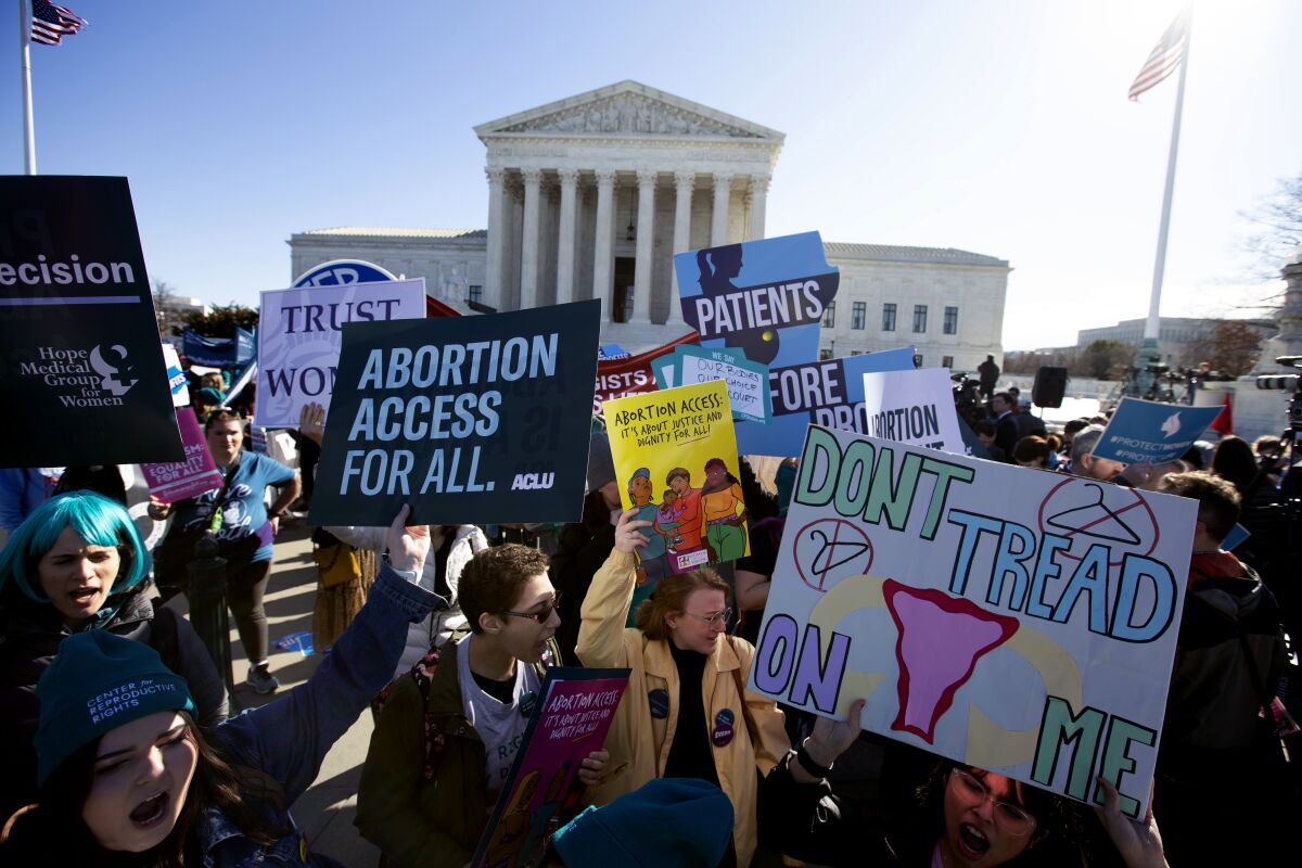 Abortion rights demonstrators and anti-abortion demonstrators rally outside the U.S. Supreme Court 