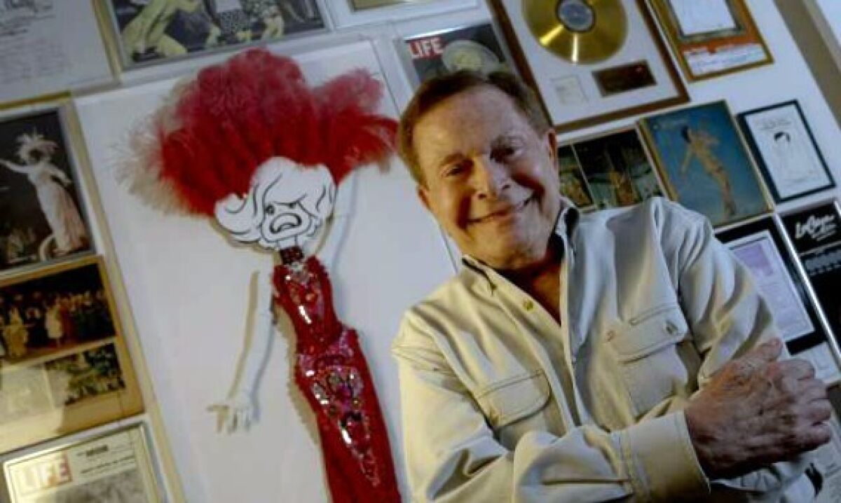 Veteran composer Jerry Herman, pictured at his Beverly Hills home in 2010, was known for his upbeat, deceptively simple lyrics and catchy tunes.