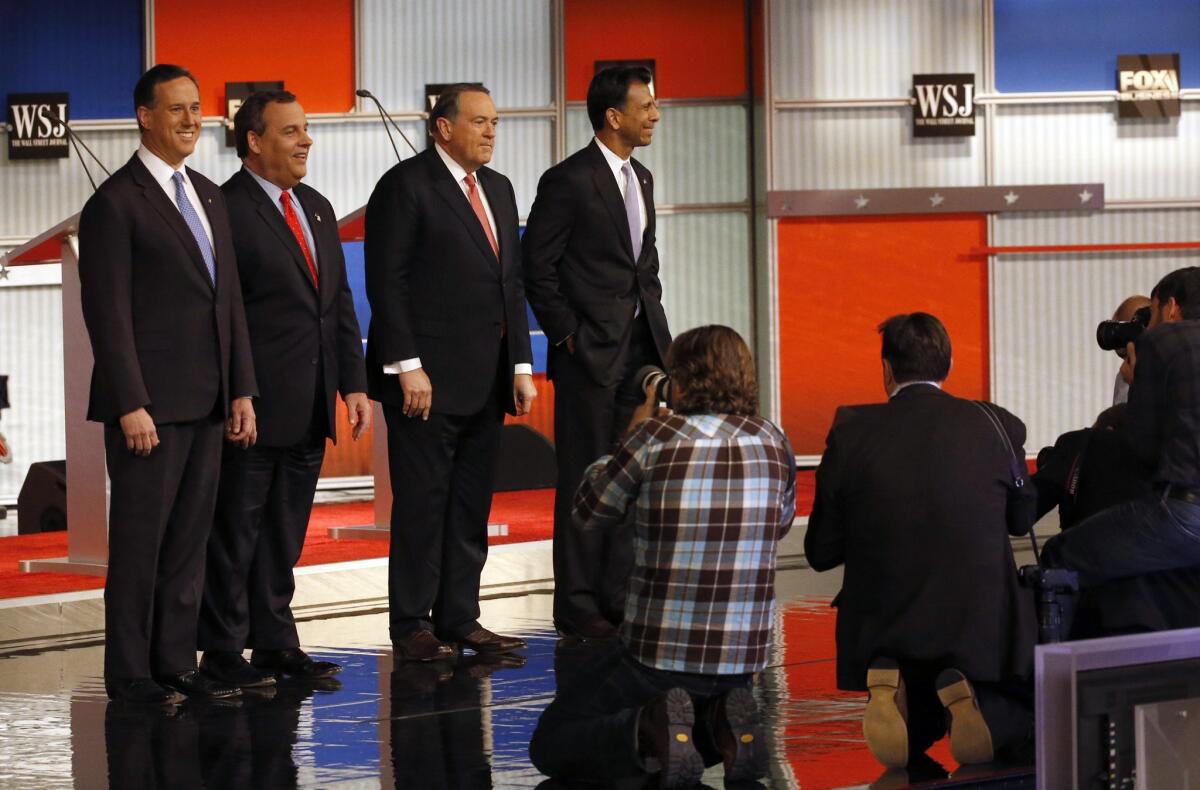 Republican presidential candidates Rick Santorum, Chris Christie, Mike Huckabee and Bobby Jindal take the stage.