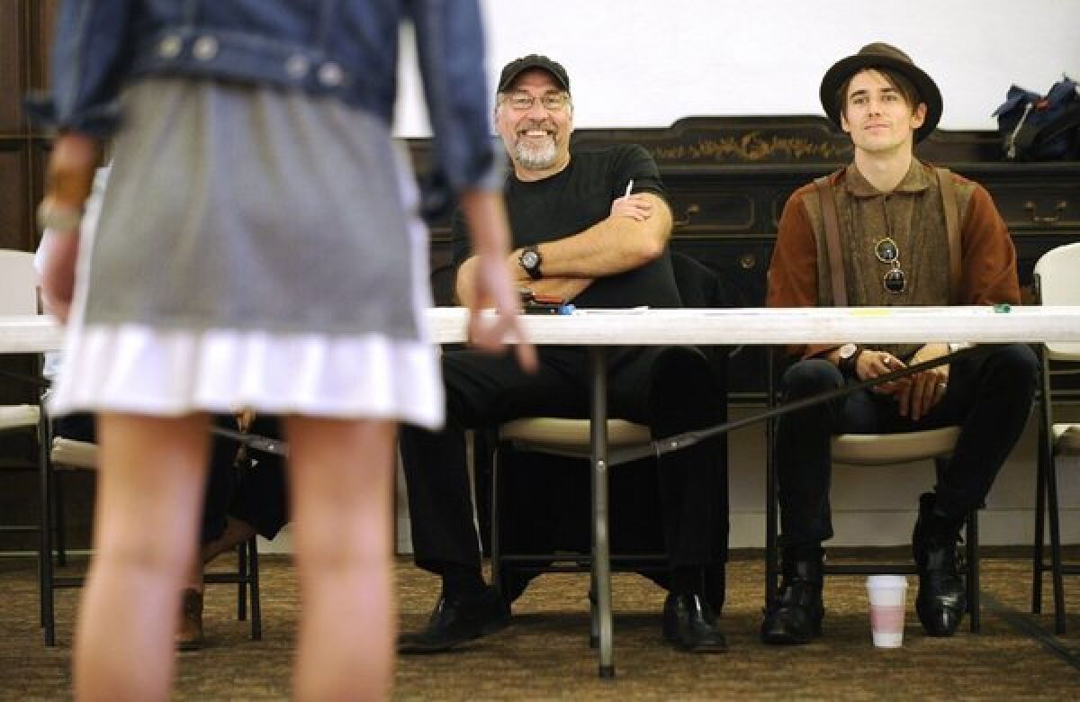 Director Philip William McKinley, left, and actor Reeve Carney watch an audition for the Broadway musical "Spider-Man: Turn Off the Dark" at the Hollywood Methodist Church in Los Angeles on Monday.