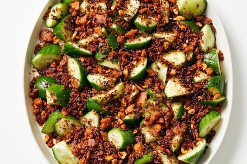 Cold chunks of cucumber are the perfect canvas for a sprinkling of crunchy, fried breadcrumbs flavored with ginger, garlic, peanuts and Szechuan pepper. Food styling by Ben Mims, with Julie Giuffrida at PropLink in downtown Los Angeles.