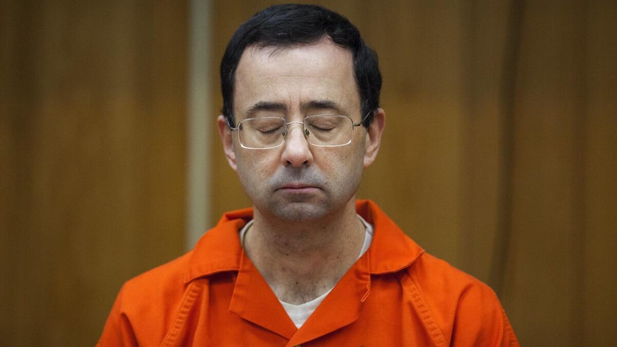 Disgraced former doctor Larry Nassar listens during his sentencing Feb. 5, 2018, in Charlotte, Mich.
