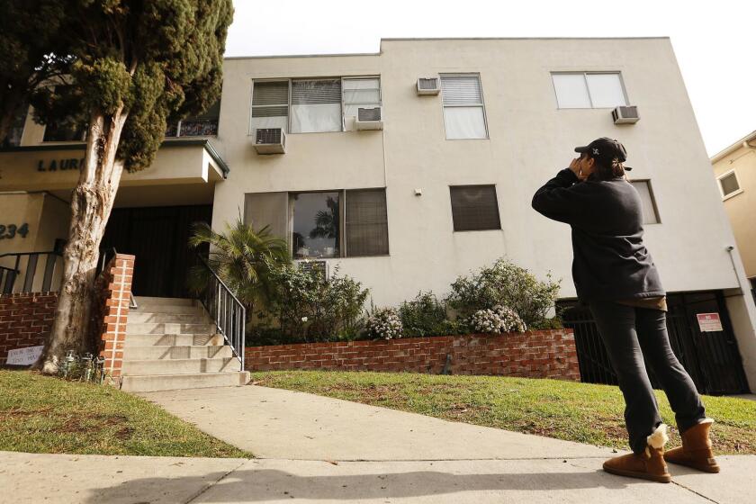WEST HOLLYWOOD, CA - JANUARY 08, 2019 Neighbor Jackie Tepper, yells at the second floor corner unit of prominent West Hollywood LGBT political activist Ed Buck in a building located at 1234 N. Laurel Ave in West Hollywood where the body of a second overdose victim was recovered. In both cases, African American men were found dead inside the home of Ed Buck. Tepper yelled at Buck who she believes is in the apartment Tuesday morning to leave the neighborhood (Al Seib / Los Angeles Times)