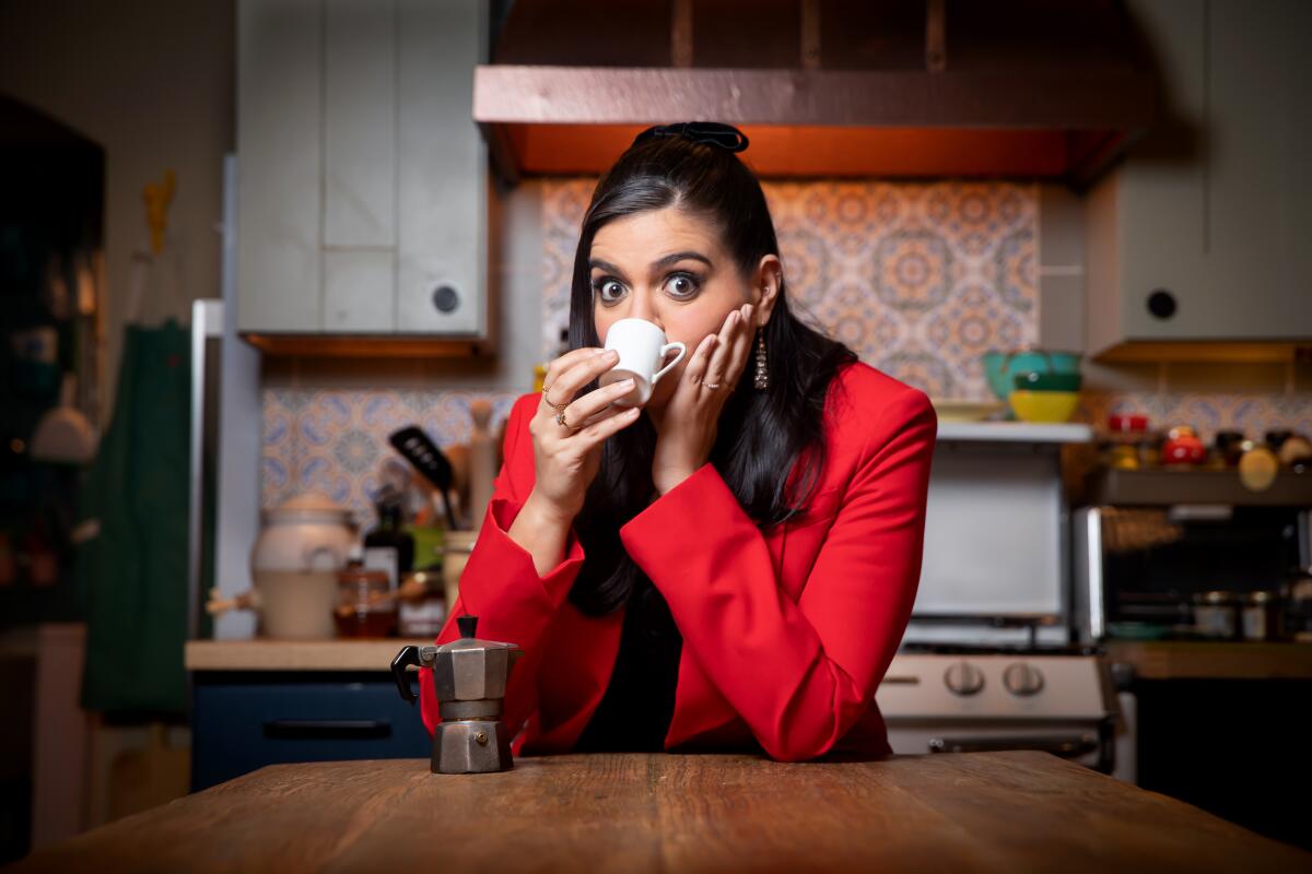 Mayan Lopez sits in the kitchen of her series set and sips an espresso.