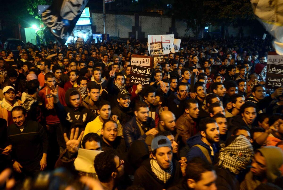 Egyptian protesters and supporters of the Muslim Brotherhood take part in a march Wednesday in Cairo against the military.